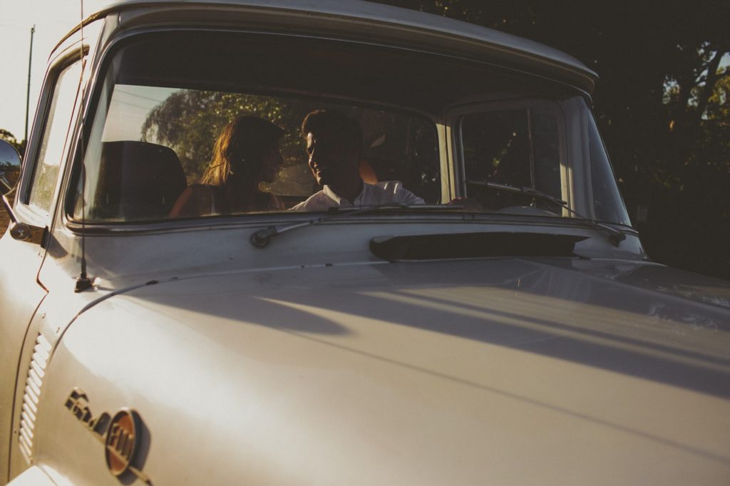 Lovers in a vintage Ford